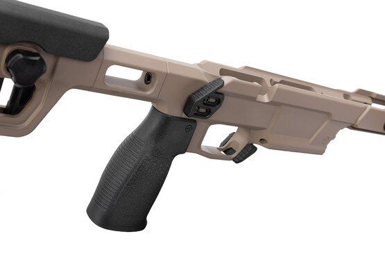 Bolt action rifle chassis with pistol grip and magazine release.